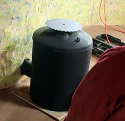 Stove made from Recycled Metal Hot Water Tank with Saw Blade Topper